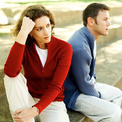 man and woman posing together